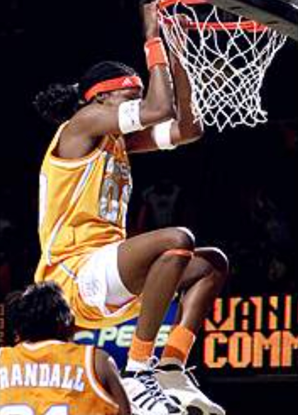 Michelle Snow finishing a dunk in a Tennessee uniform during a college game